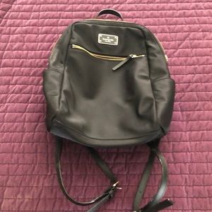 Black Kate Spade bookbag.